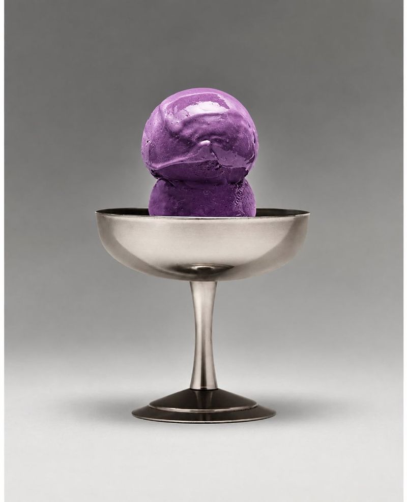 A purple scoop of ube in a metal coupe