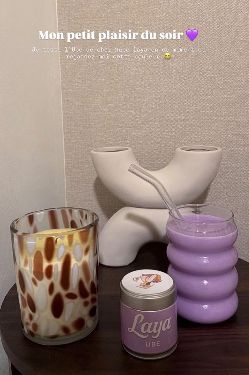 Iced ube latte next to a jar of Laya Ube